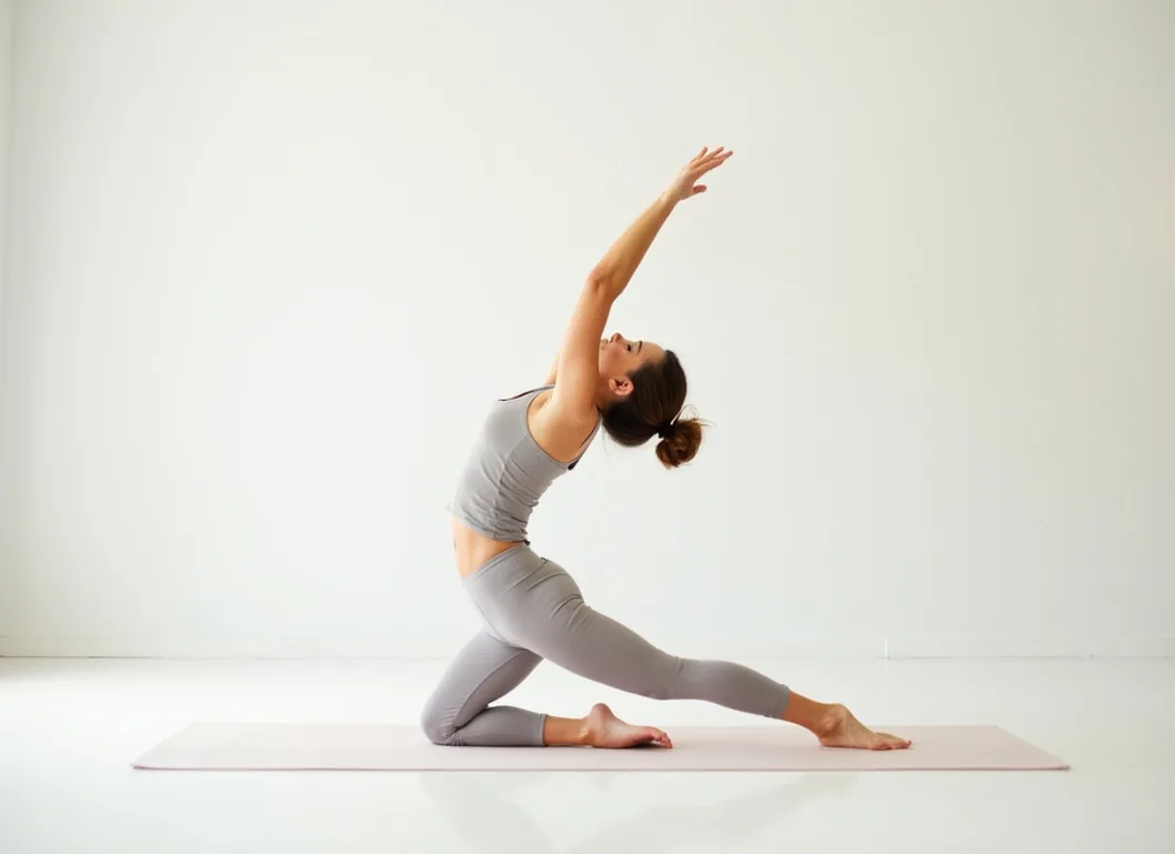 Woman doing yoga pose in bright minimalist studio